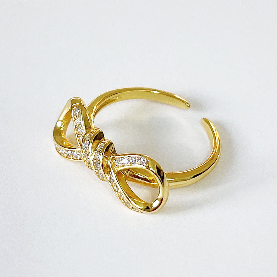 Anillo minimalista de plata de ley 925 chapado en oro con lazo y circonita cúbica