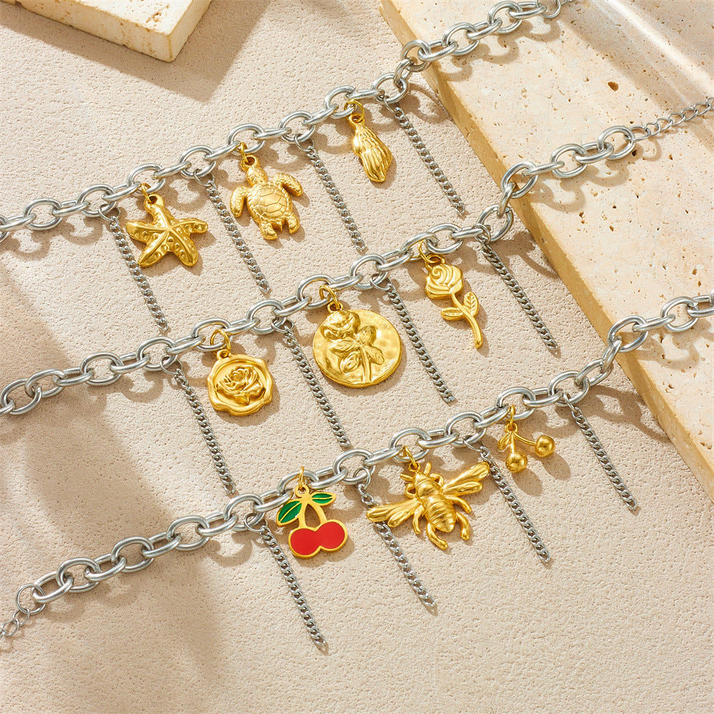 Bracciale unico in acciaio inossidabile color-block con ciondoli a forma di ape, fiore, stella marina e ciliegia