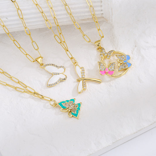 Collana con ciondolo minimalista a farfalla e libellula da donna, con base in rame placcata in oro 18 carati e intarsio in zirconi