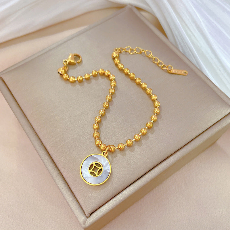 Pulsera redonda con diseño de conchas y cuentas estilo vintage para mujer, hecha de acero de titanio con acabado chapado