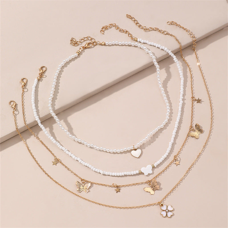 Bonito collar con dije de aleación esmaltado en forma de corazón para niños con cadena de eslabones torcidos