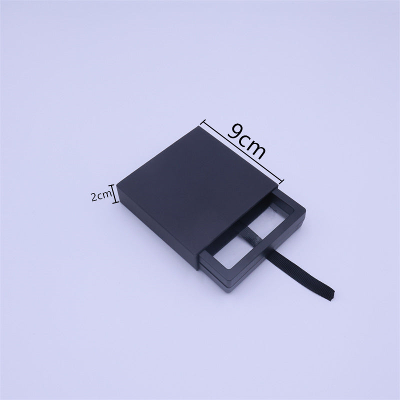 Scatola portagioie minimalista in carta nera con coperchio sollevabile per orecchini, bracciali, anelli e collane