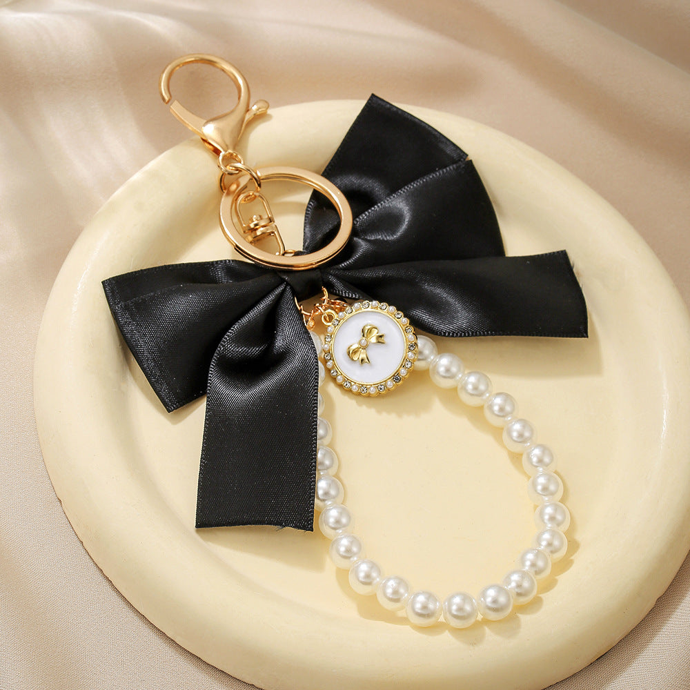 Sweet Cartoon Bow Pearl Zinc Alloy Keychain Bag Charm