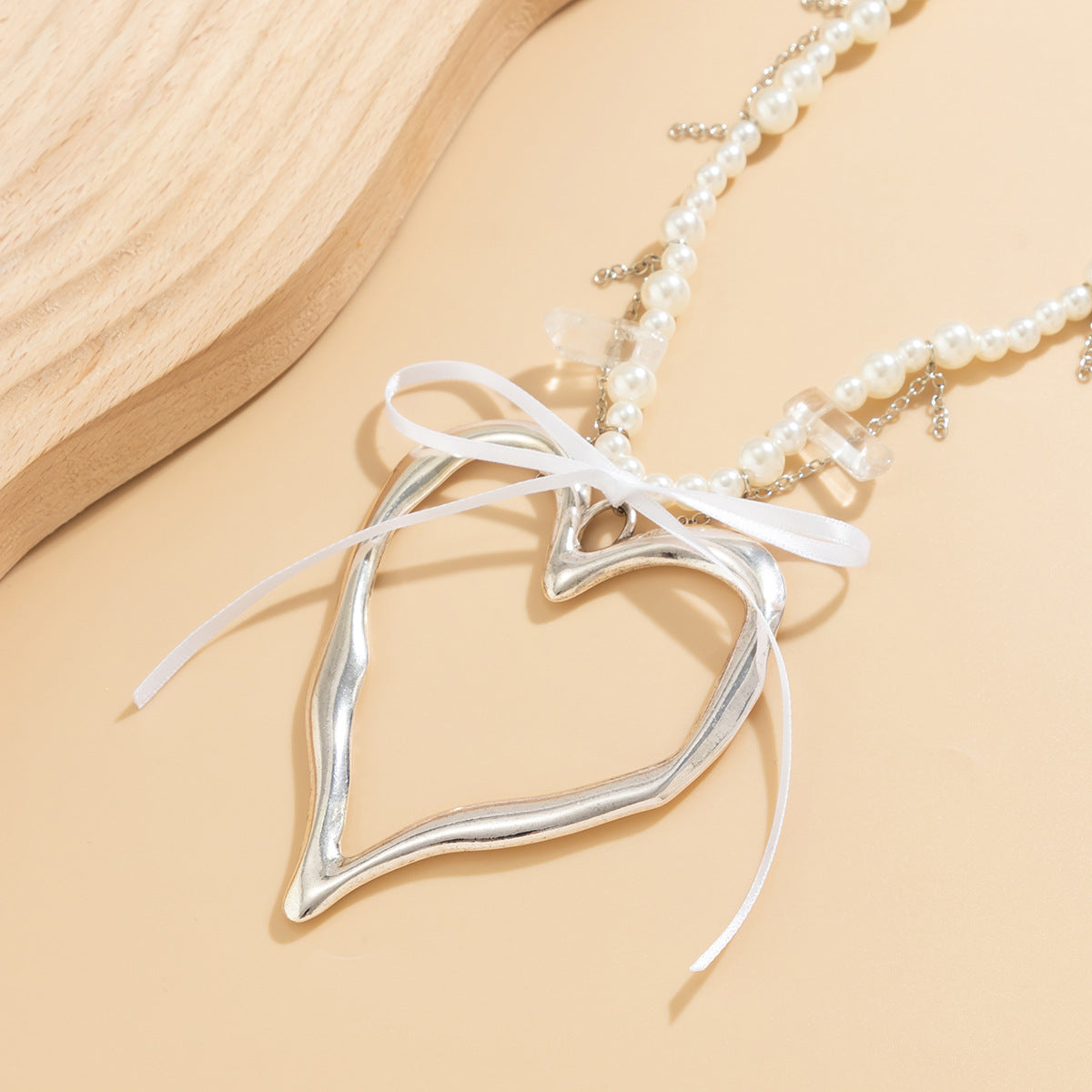 Collana da donna con ciondolo a cuore e fiocco in lega galvanizzata stile Ins