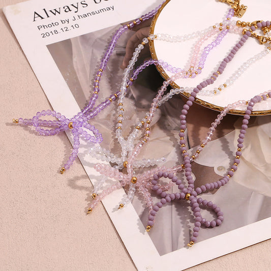 Collana con ciondolo alla moda in acciaio al titanio a forma di fiocco con perline in acciaio inossidabile galvanizzato da donna