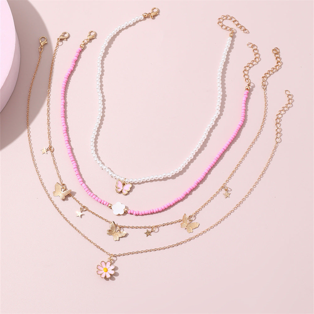 Set collana con pendente a farfalla rosa e floreale per bambini con perle in resina e ciondolo in lega, finitura smaltata, catena a sfere rotonde