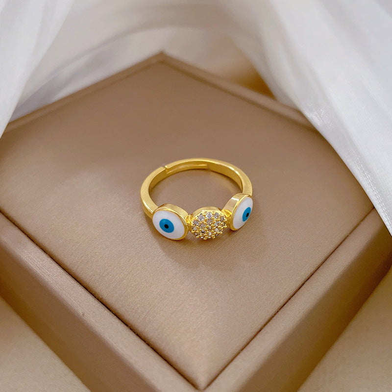 Anello da donna in ottone placcato oro con zirconi micro-incastonati a forma di occhio minimalista