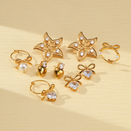 Elegante conjunto de pendientes y anillo de acero de titanio con forma de corazón y motivo de estrella de mar, galvanizado para un aspecto premium resistente a la decoloración