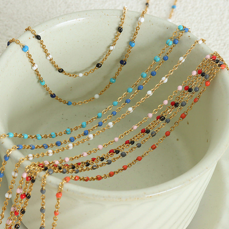 Conjunto minimalista de collar y pulsera de cadena con eslabones O de acero de titanio y detalles de esmalte para mujer