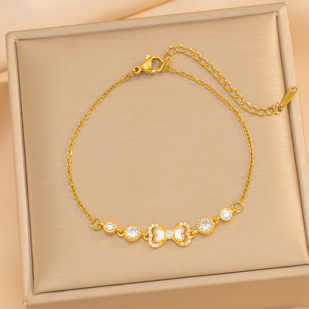 Elegant Butterfly Knot Shaped Titanium Steel Bracelet with Rhinestone Inlay and Gold Plating for Women