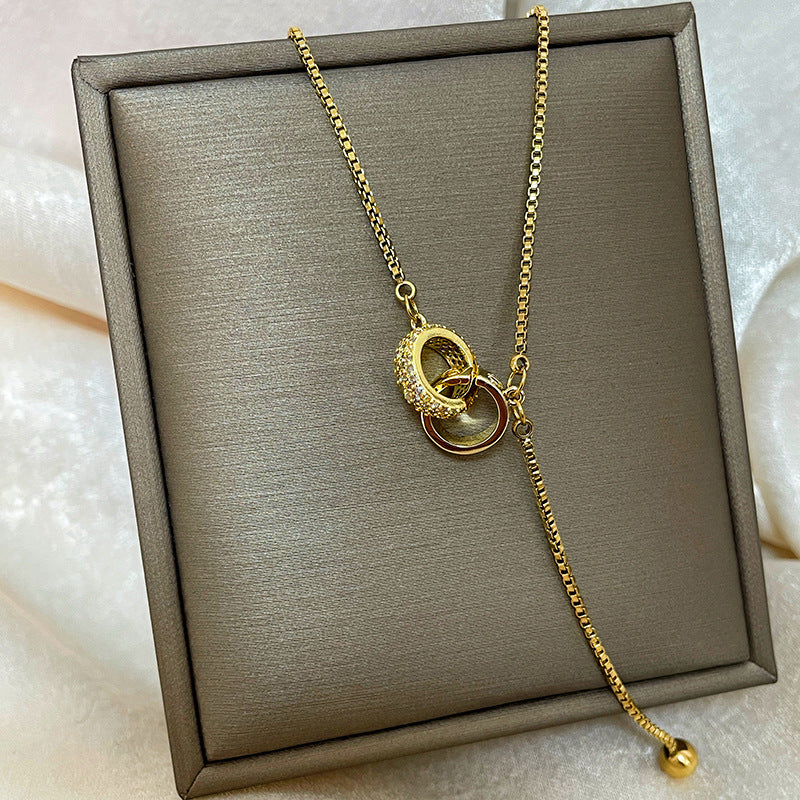 Collana con ciondolo a goccia in rame placcato oro 18 carati con micro-pavé e catena a onda in acciaio al titanio, design originale