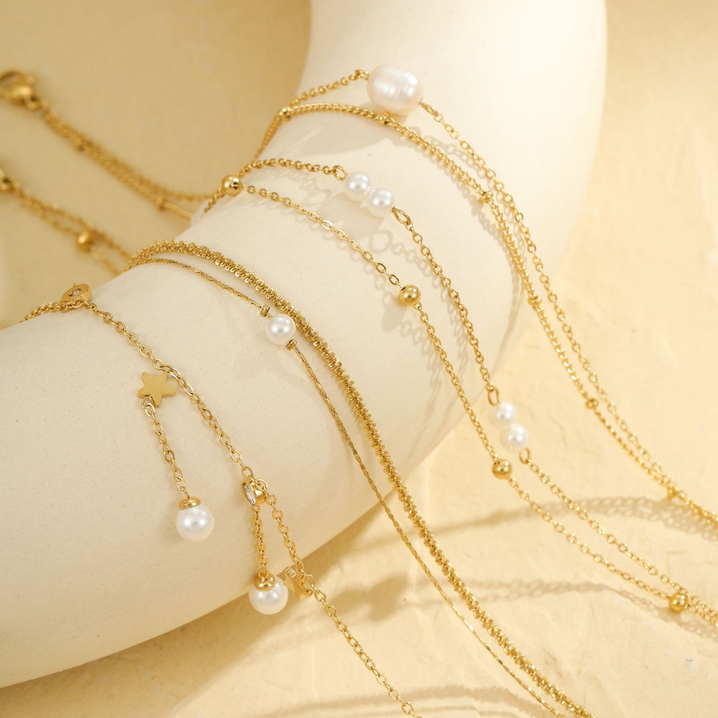 Tobillera minimalista geométrica de acero inoxidable con borla y detalles de perlas para mujeres y hombres
