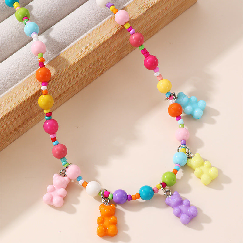 Collana con ciondolo a fiocco dolce pastello per ragazze con ciondolo in resina su catena a O, gioielli in stile cartone animato