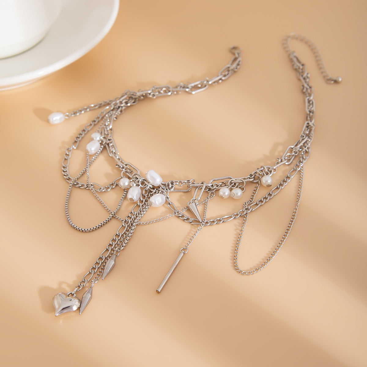 Sweet and Edgy Heart-Shaped Rivet Pendant Necklace for Women with Alloy and Stainless Steel, Electroplated Finish, Tassel Detail, Box Chain