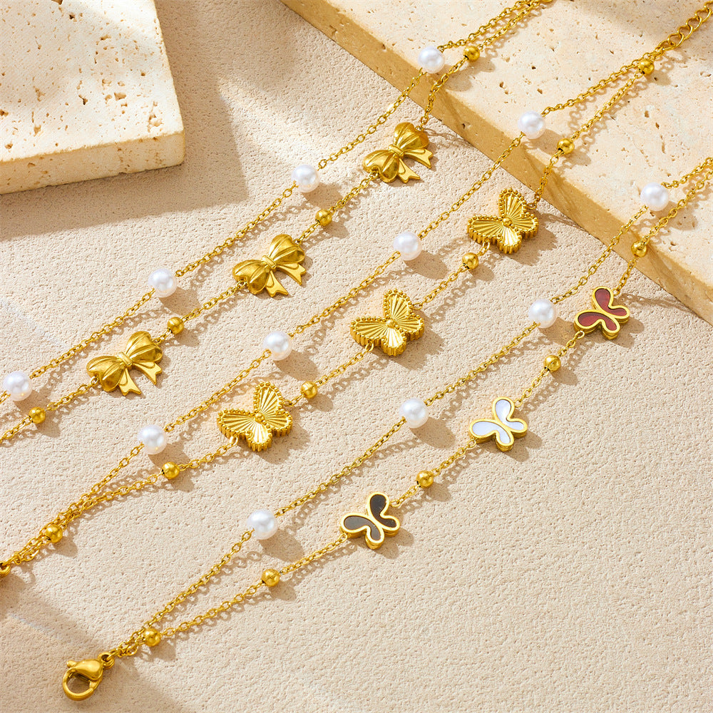 Bracciale minimalista da donna in acciaio inossidabile a forma di fiocco con placcatura in oro e inserti di perle