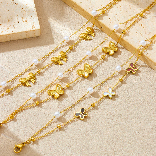 Pulsera minimalista de acero inoxidable con forma de lazo, chapada en oro y con detalles de perlas para mujer