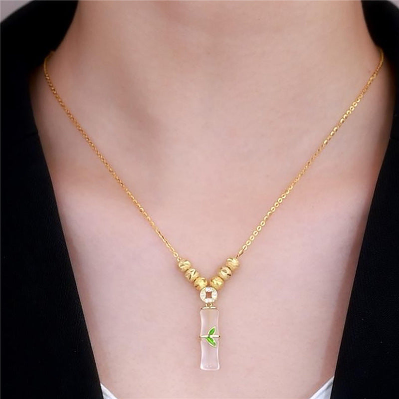 Collar minimalista de acero de titanio con forma de nudo de bambú para mujer con baño de oro y colgante floral irregular