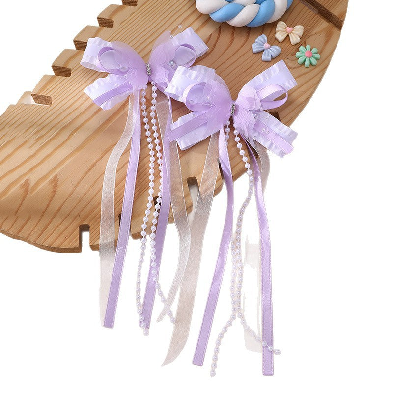 Pinza de pelo en forma de lazo de estilo natural para niños con detalles de volantes y malla hecha de resina plástica