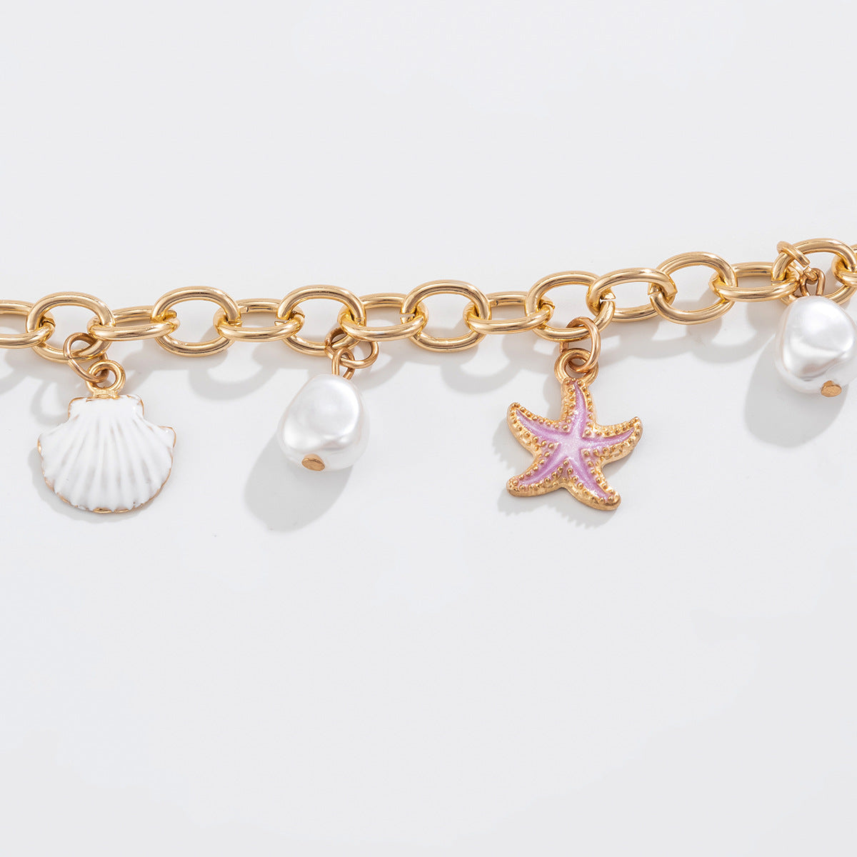 Collana pendente minimalista con stella e conchiglia, nappina e design a coda di sirena, in lega con finitura placcata