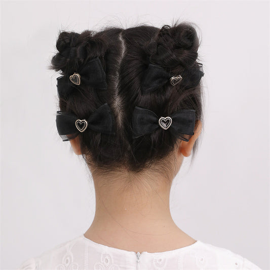 Sweet and Edgy Black Bow Hair Clip Set for Kids with Mesh and Heart Design, Four-Piece Hair Accessories Collection