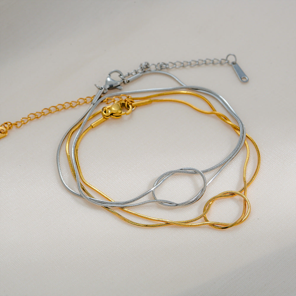 Braccialetto Minimalista a Forma di Arco in Acciaio al Titanio Placcato Oro per Coppie con Design a Catena Serpente