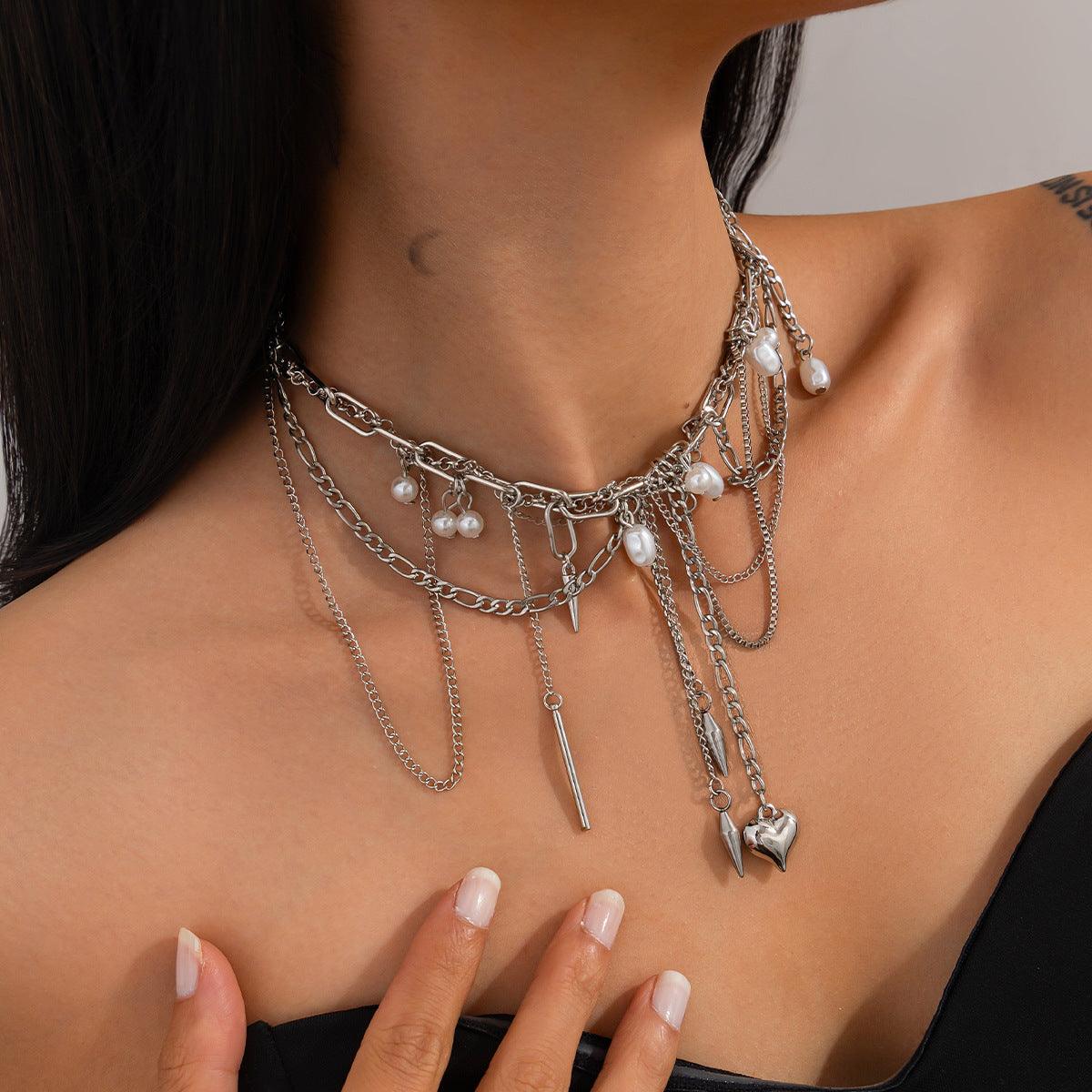 Sweet and Edgy Heart-Shaped Rivet Pendant Necklace for Women with Alloy and Stainless Steel, Electroplated Finish, Tassel Detail, Box Chain
