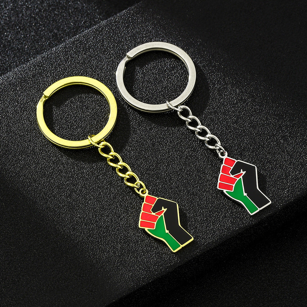 Accessorio pendente portachiavi in ​​acciaio al titanio a forma di pugno in stile etnico per uomo e donna