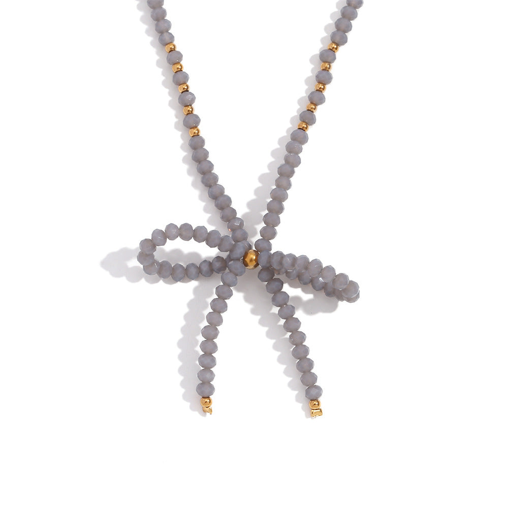 Collana con ciondolo minimalista a forma di fiocco in acciaio inossidabile con strass da donna