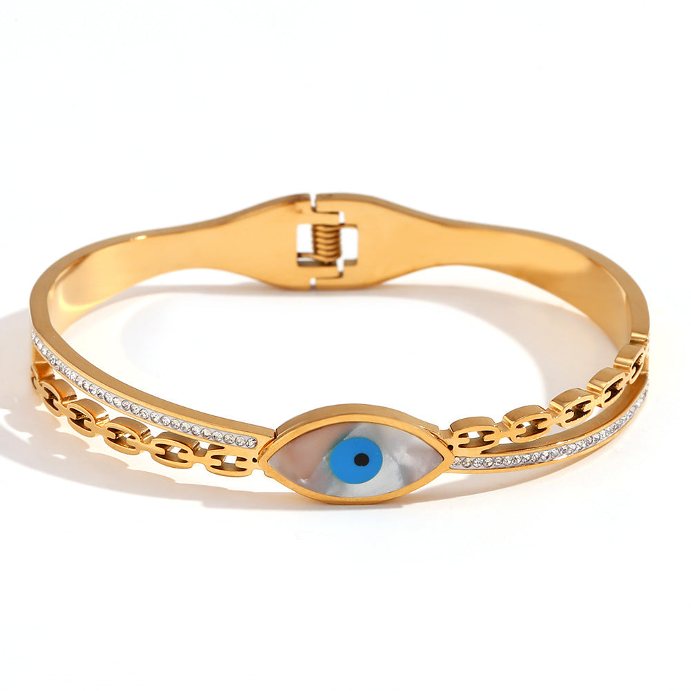 Bracciale minimalista di tendenza in acciaio inossidabile con placcatura in oro 18 carati e ciondolo a forma di occhio di Nazar micro-incastonato su chiusura a molla