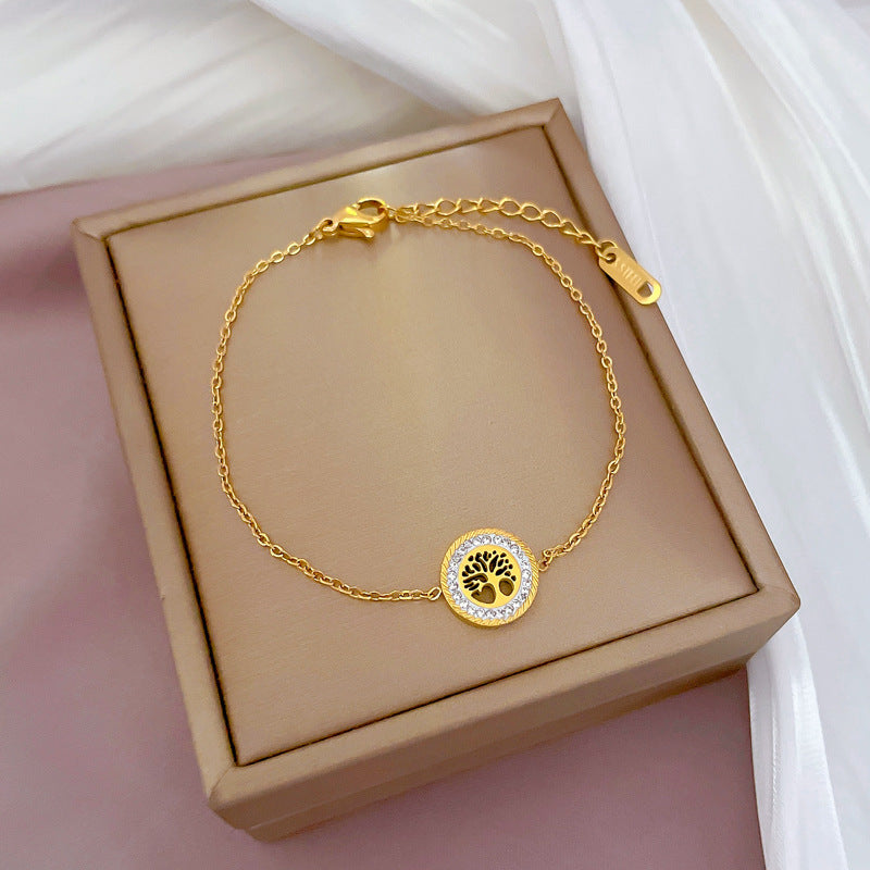 Bracciale da donna in stile vintage con disco rotondo "Albero della Vita" in acciaio al titanio con intarsio in strass e placcatura in oro