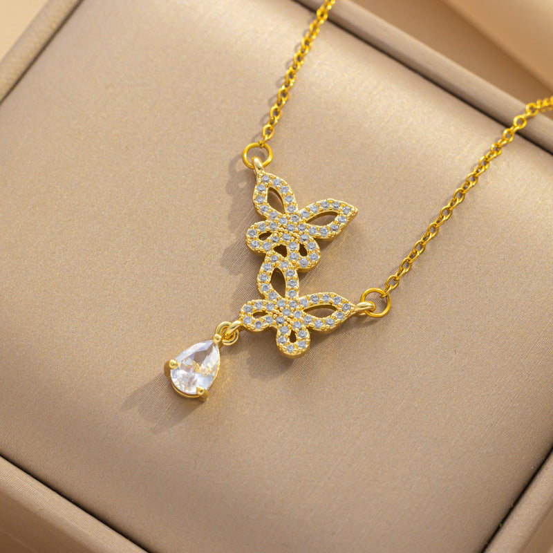 Collar con colgante minimalista de nudo de lazo de acero de titanio para mujer con cadena de serpiente chapada