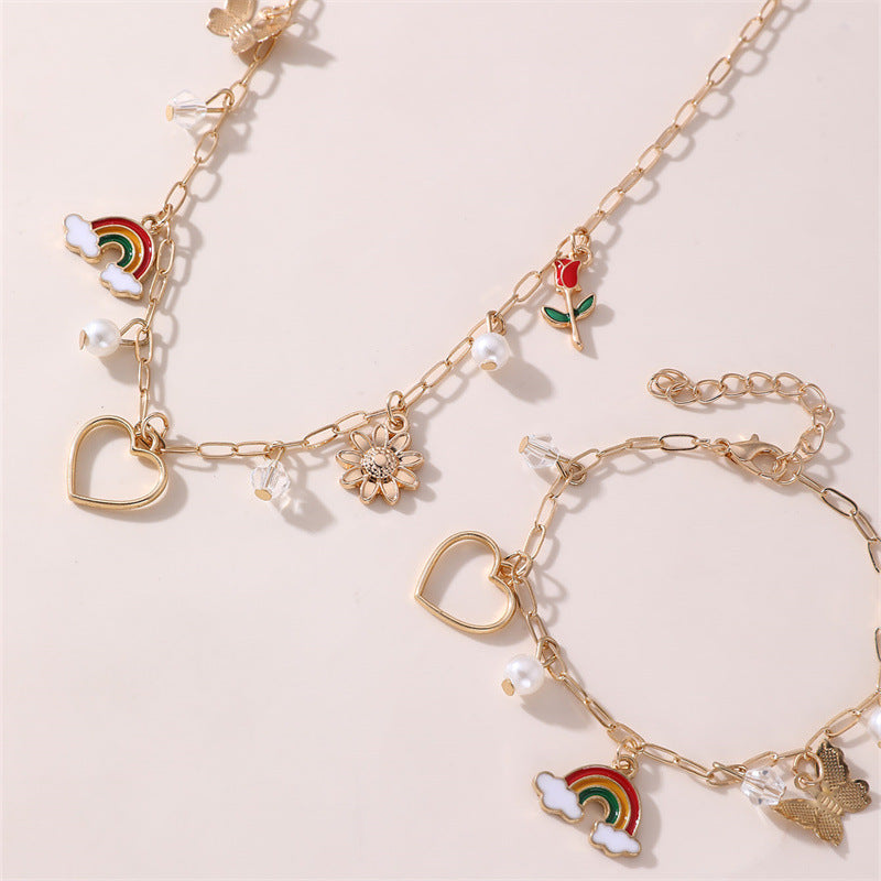 Collana con ciondolo a farfalla floreale e fiocco per bambine, lega di zinco, design a cuore, arcobaleno e rosa