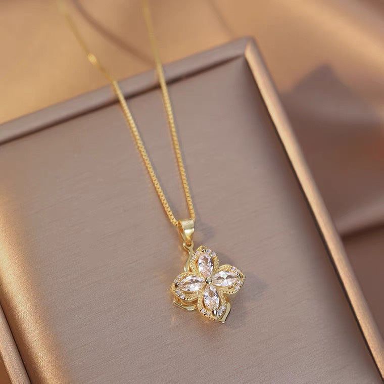 Collana con ciondolo girevole a quadrifoglio con charm in rame placcato oro su catena O in acciaio al titanio per uomo e donna