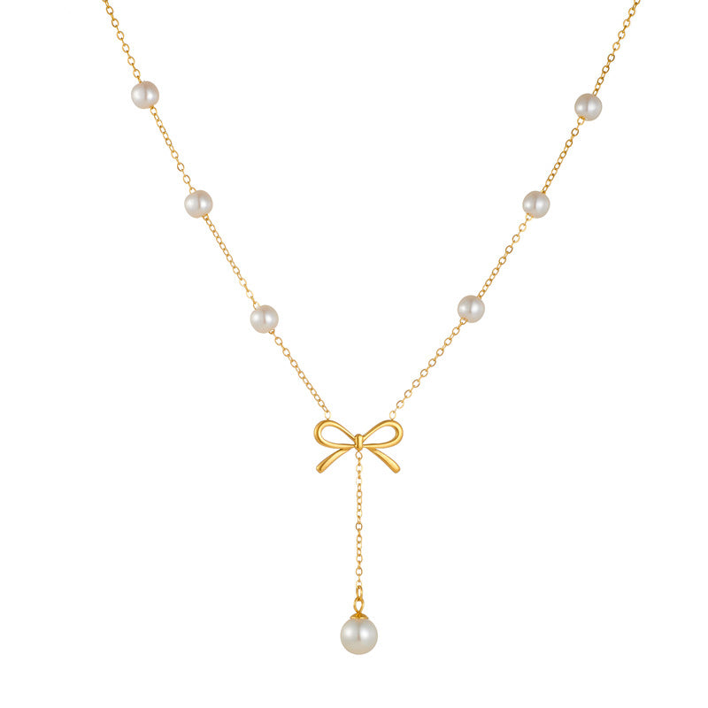Set di collana e orecchini a farfalla con fiocco in acciaio inossidabile placcato oro da donna
