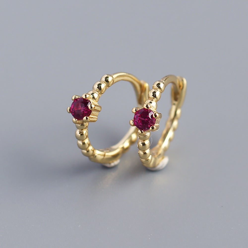 Orecchini a perno tondi con intarsi di diamanti in argento sterling 925