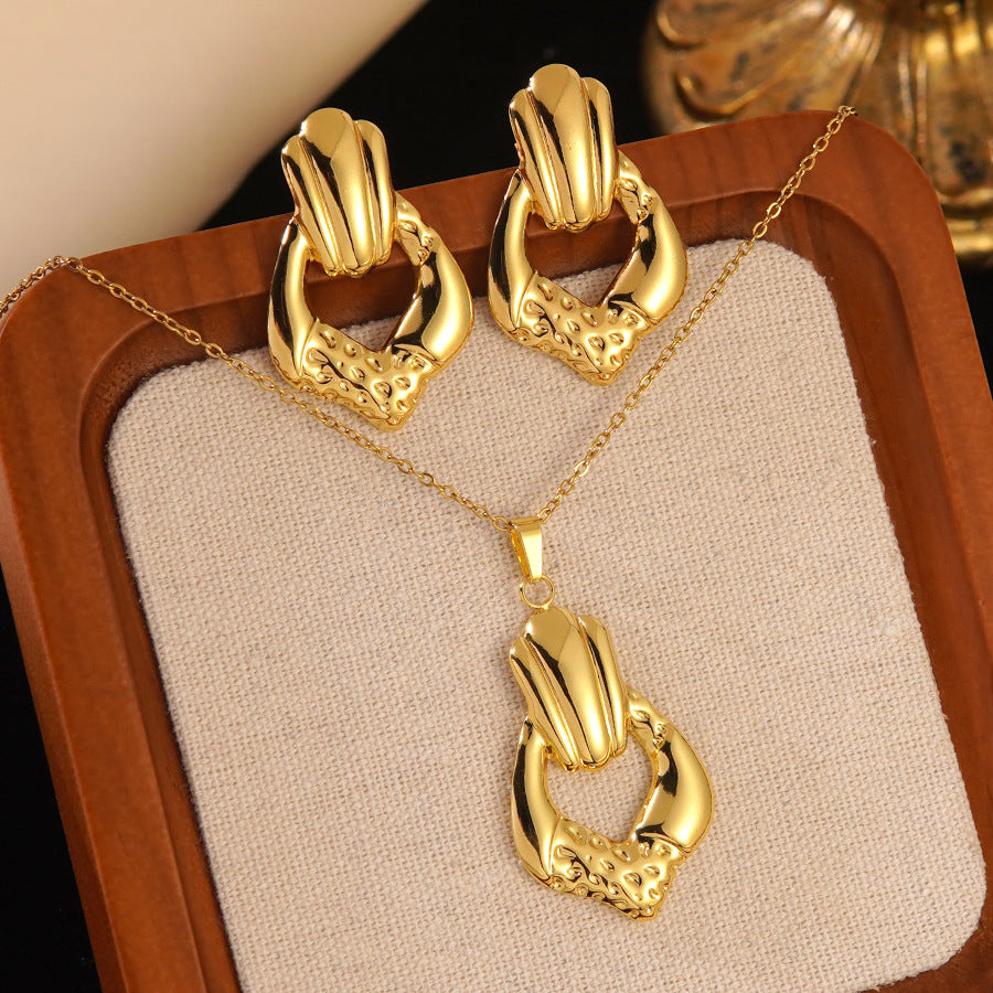 Conjunto de joyas de acero inoxidable con baño de oro minimalista con colgante de corazón floral y lazo en cadena para mujer