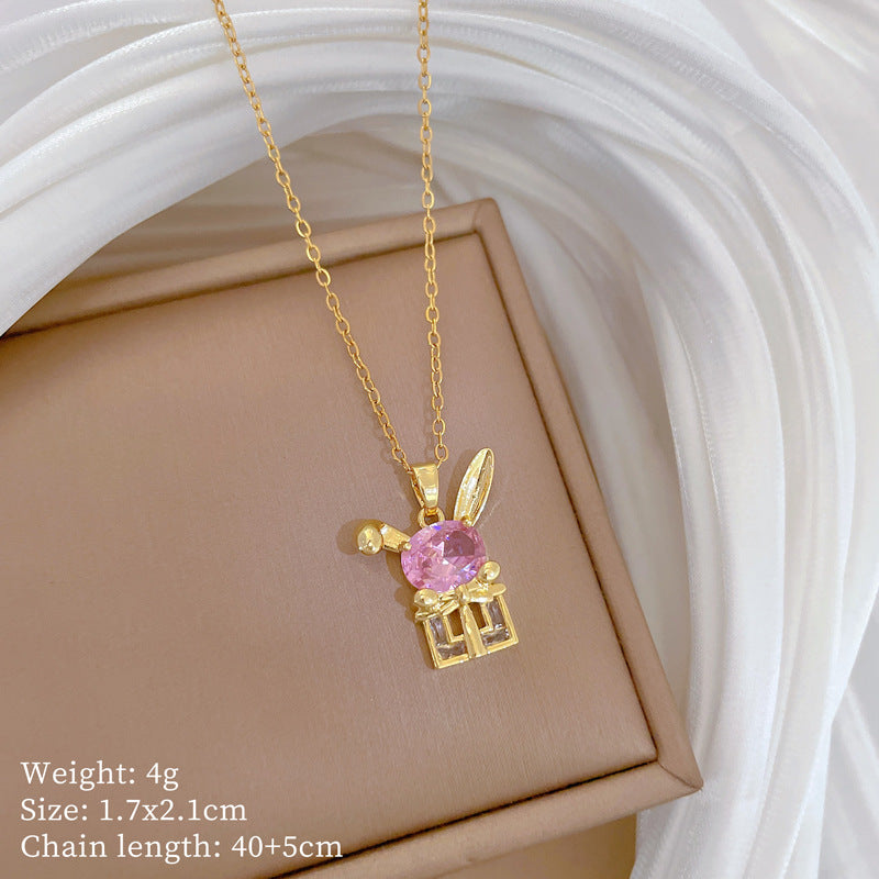Collana con ciondolo coniglio a fiocco in stile cartone animato per donna con intarsio in strass su catena in acciaio al titanio