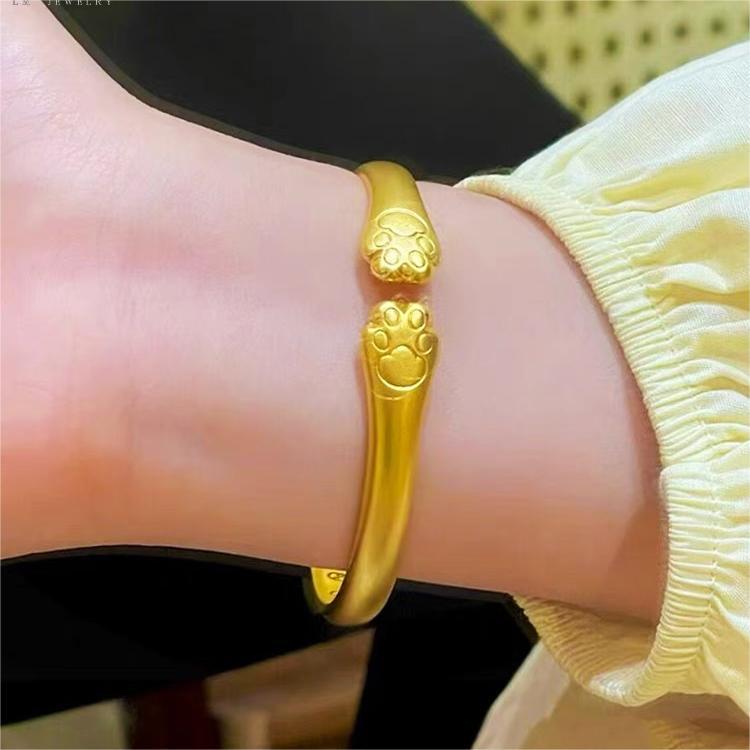 Bracciale a forma di zampa di gatto carino in rame placcato oro per donna con design delicato ed elegante