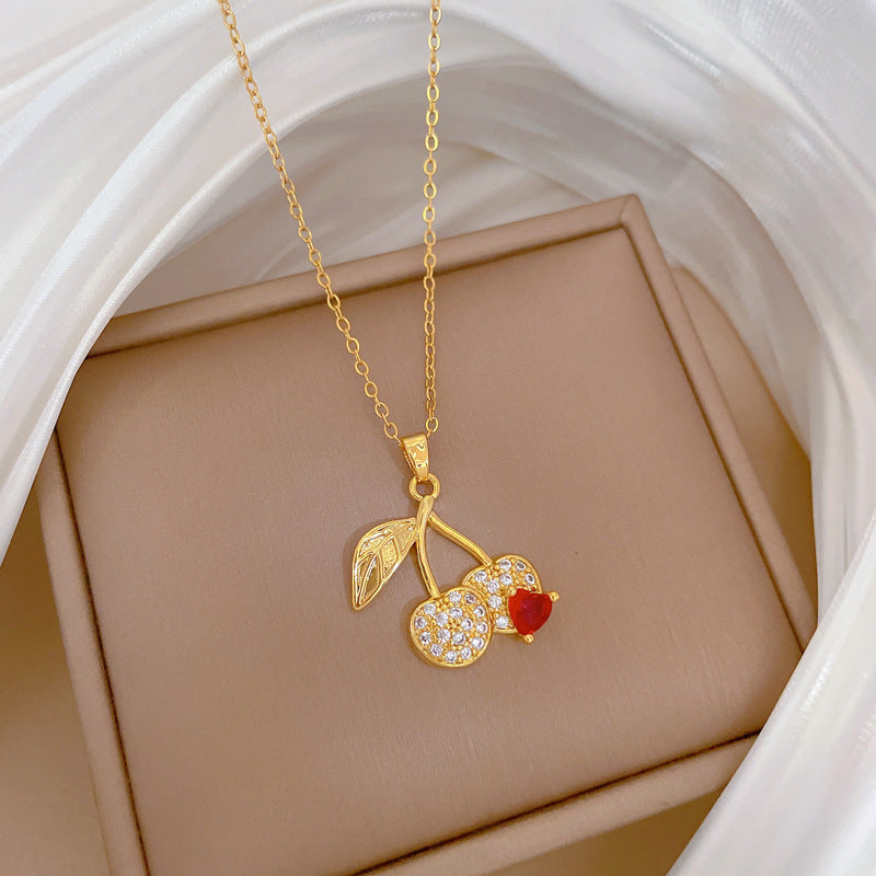 Collana con ciondolo a ciliegia stile cartone animato con strass per donna, catena in acciaio al titanio, design geometrico, stile minimalista a medaglione