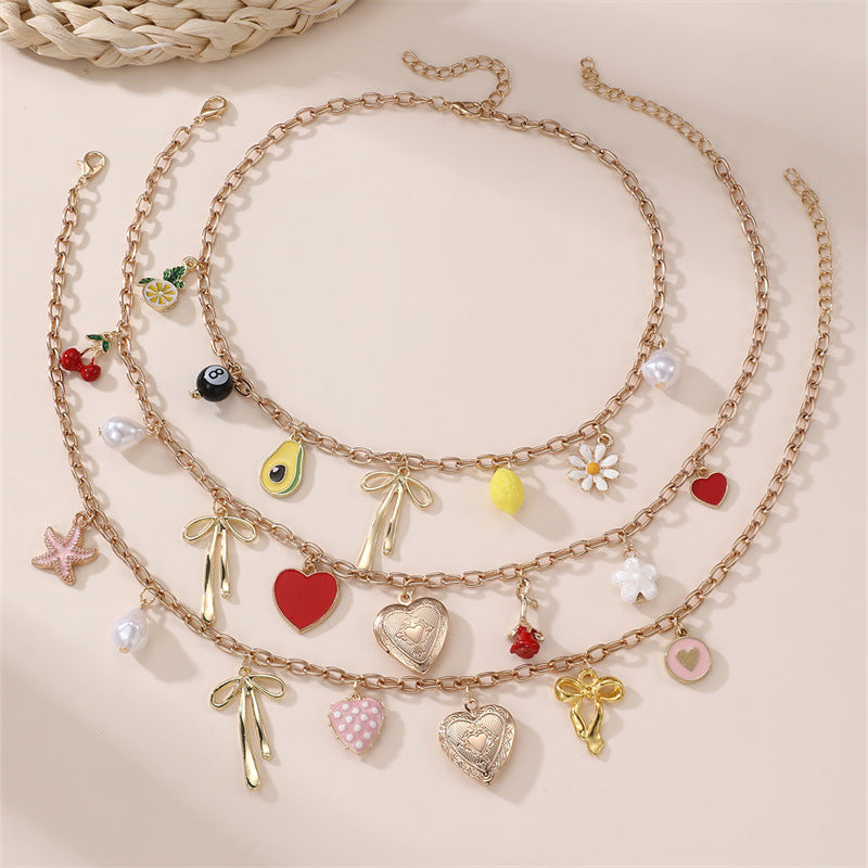 Collana a forma di fiocco minimalista in lega per bambine con finitura smaltata, catena regolabile con perline rotonde, collana con ciondolo stile principessa per bambini