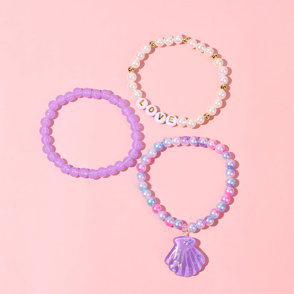 Juego de pulseras de resina con cuentas en forma de corazón estilo caricatura con dijes de cola de sirena y conchas marinas para niños