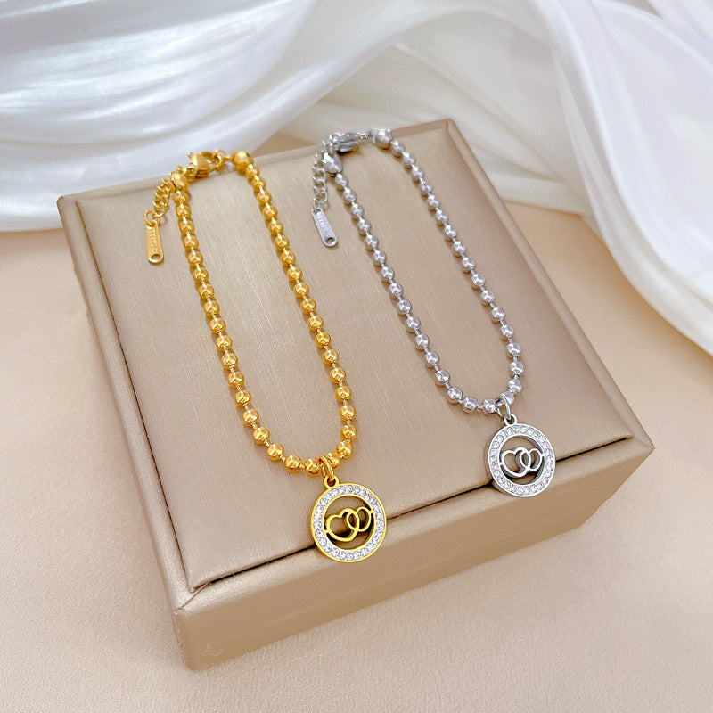 Retro Minimalist Double-Ring Heart Bracelet for Women Made of Titanium Steel with Gold Plating and Wavy Texture