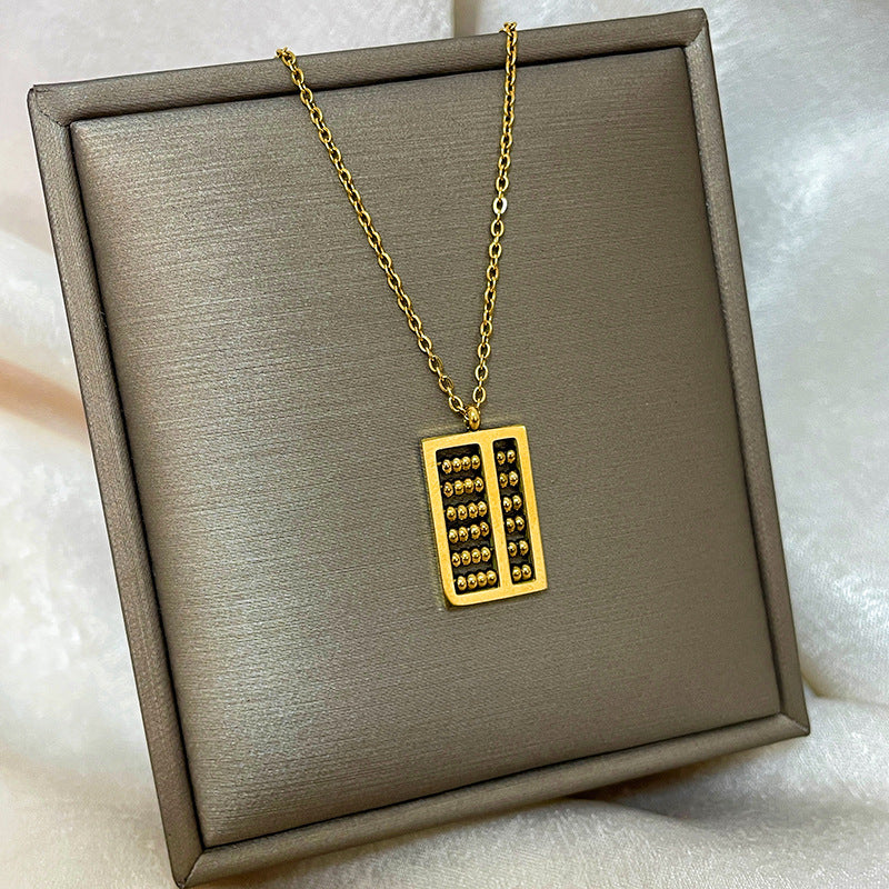 Collana con ciondolo a goccia in rame placcato oro 18 carati con micro-pavé e catena a onda in acciaio al titanio, design originale