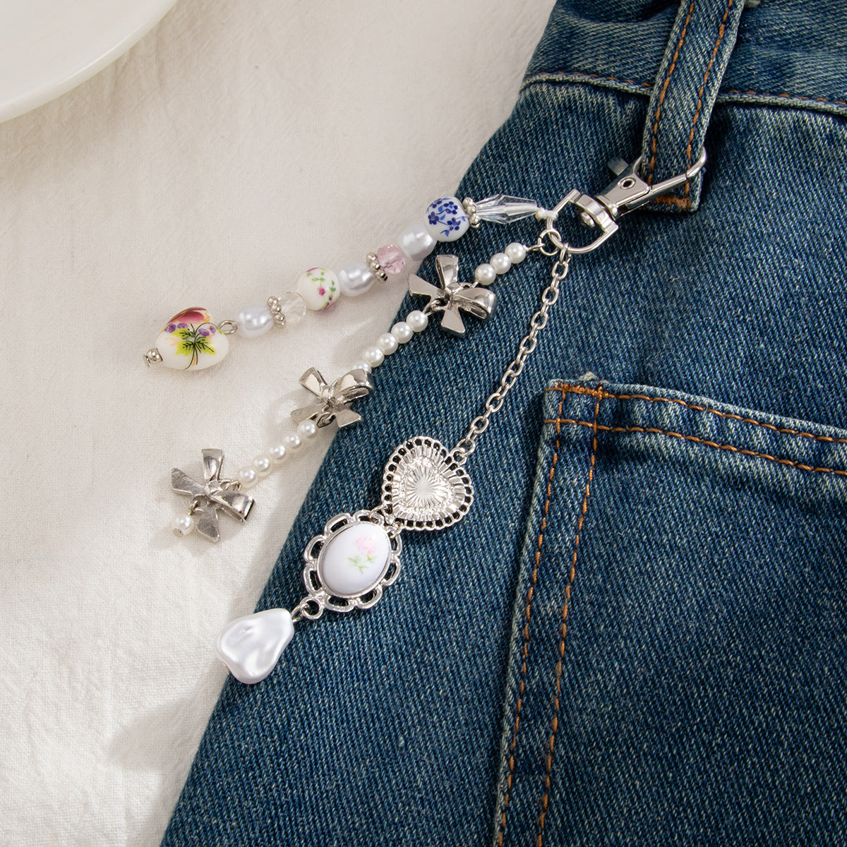 Minimalist Zinc Alloy Heart Pendant with Ceramic Pearl and Tassel Keychain Bag Charm