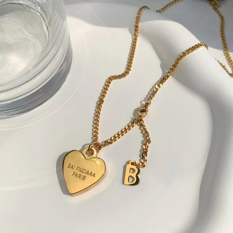 Minimalist Luxe Heart-Shaped Titanium Steel Necklace for Women with Gold Plating and Cross Chain Design
