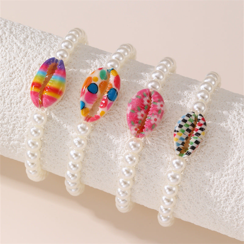 Braccialetto elastico da ragazza fatto a mano con perline in resina a forma di stella, dettagli in perle e stampa floreale