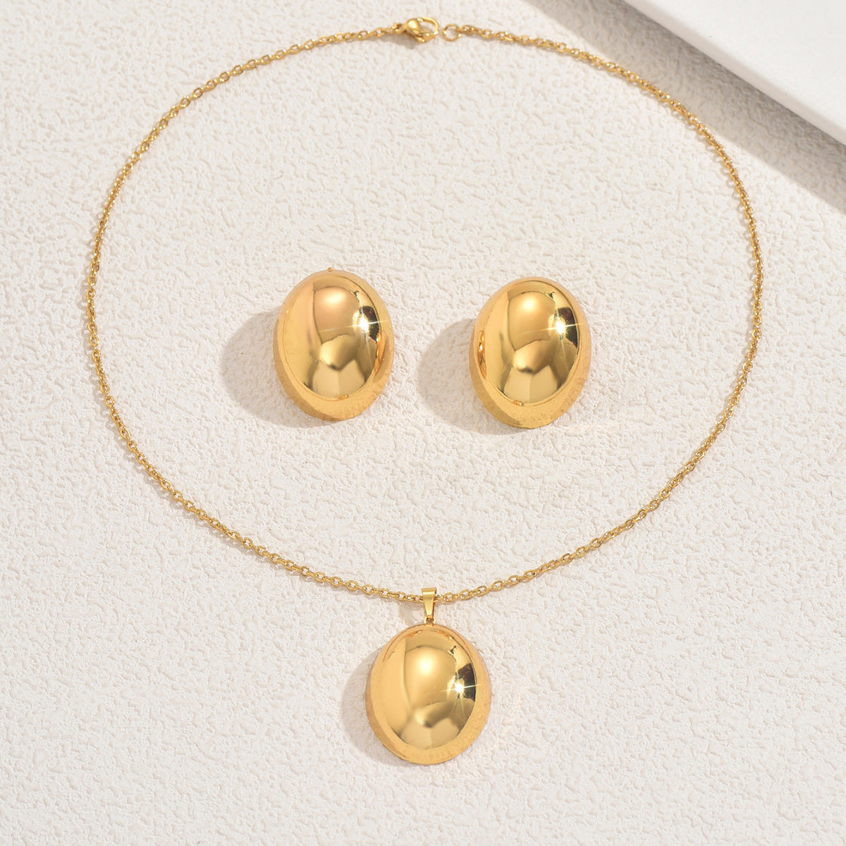 Set di collana e orecchini a pendente a cuore geometrico in lega con finitura placcata per donna