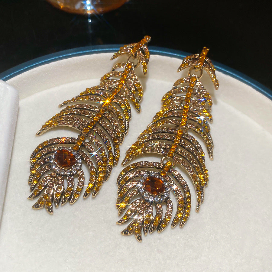 Orecchini a perno artistici vintage in lega a forma di piuma e foglia con intarsio di strass per donna
