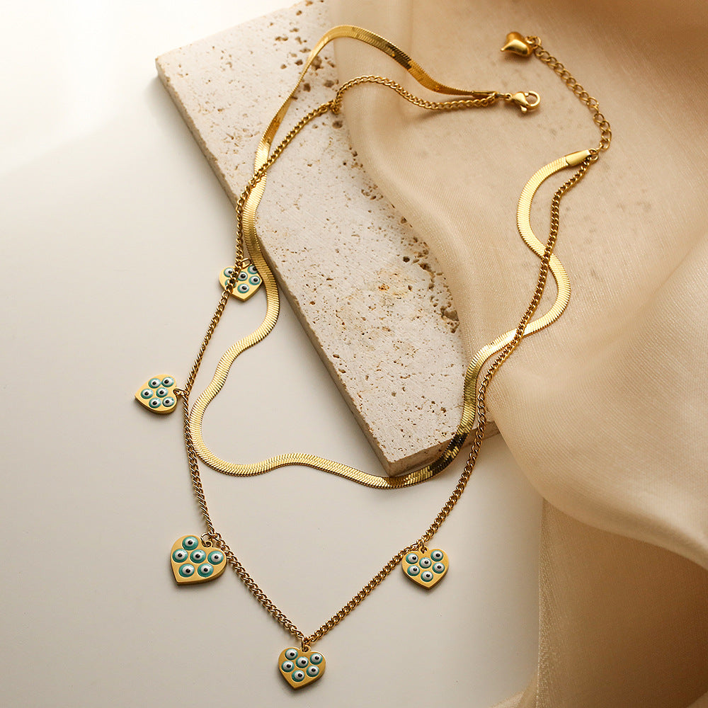 Collana da donna a doppio strato con catena alla clavicola in acciaio al titanio e ciondolo a forma di occhio geometrico smaltato minimalista