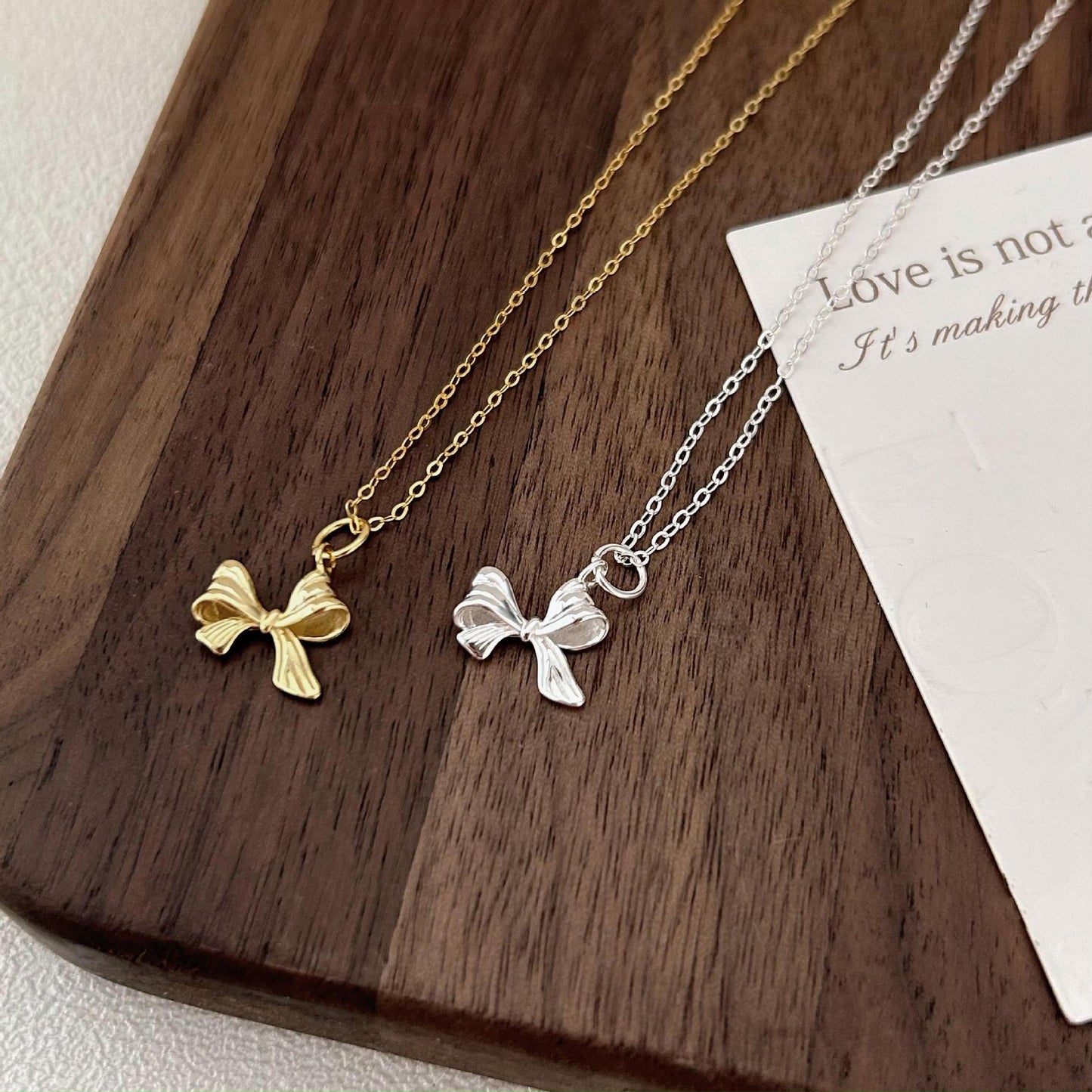 Minimalist Bow Knot Pendant Necklace in 925 Sterling Silver with Plated Finish on Cross Chain